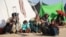Families who fled their villages after the Taliban launched massive attacks in different districts of Helmand Province live in temporary shelters in the provincial capital of Lashkar Gah on November 24.