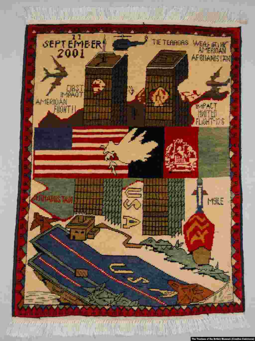 A depiction of the September 11, 2001, terrorist attacks includes two figures falling from the World Trade Center twin towers and a dove of peace between the U.S. and Afghan flags. &nbsp;