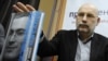 Writer Boris Akunin presents "Mikhail Khodorkovsky: Articles. Dialogues. Interviews" at a book launch in Moscow.