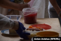 Volunteers prepare meals at a charity soup kitchen in Kharkiv.