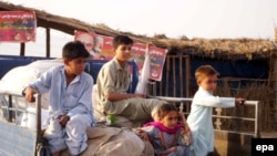 Pakistani refugees preparing to go back to Swat at a refugee camp on the outskirts of Peshawar 