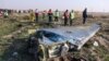 Emergency crews survey the scene of a Ukrainian jetliner shot down by an Iranian missile near Tehran.