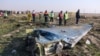 Rescue teams are seen on January 8, 2020 at the scene of a Ukrainian airliner that was shot down shortly after take-off near Imam Khomeini airport in the Iranian capital Tehran. 