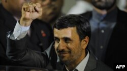Iranian President Mahmud Ahmadinejad gestures upon his arrival at Maiquetia Airport in Caracas, Venezuela, on January 8.