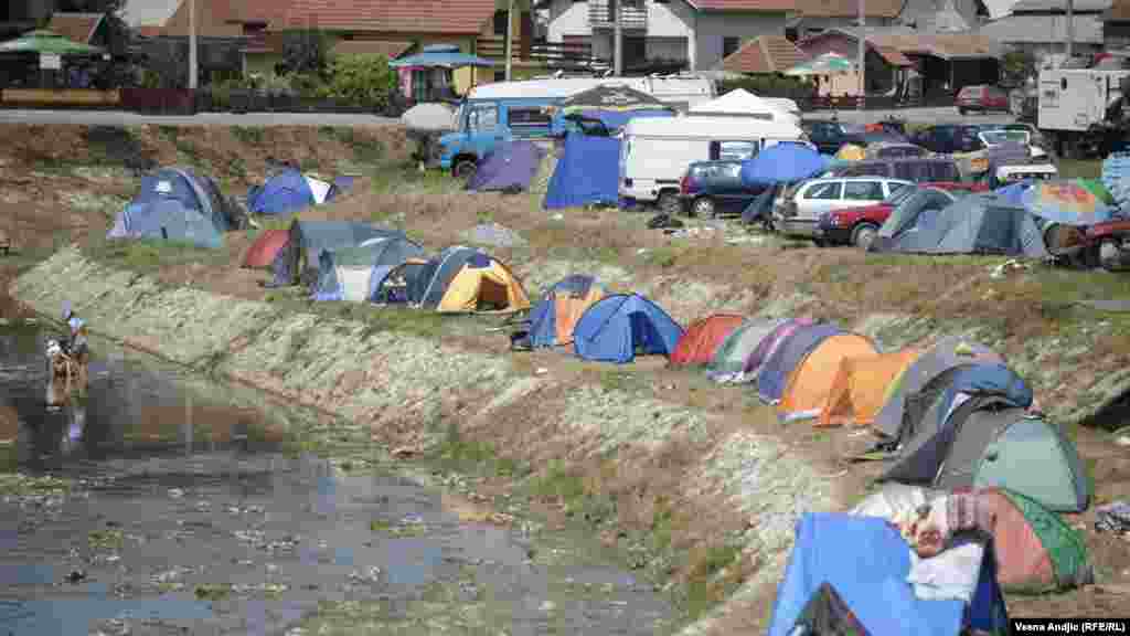 Many visitors sleep in tents pitched by the Bjelica River.