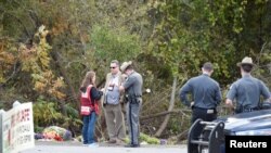 New York State Troopers at the site of a limousine accident that killed 20 people on October 6. 