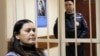 Russia -- Gulchekhra (Gyulchekhra) Bobokulova, a nanny suspected of murdering a child in her care, sits inside a defendants' cage as she attends a court hearing in Moscow, March 2, 2016