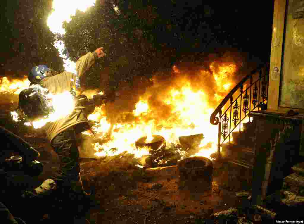 A protester throws a petrol bomb late on January 22.