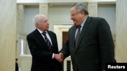 Greek Foreign Minister Nikos Kotzias (right) welcomes UN envoy Matthew Nimetz in Athens on January 30.