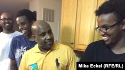 Faisal Abdi (center) stands in his kitchen along with his sons Kayse, Guleid, and Samakb after watching the third, and final, presidential debate between Republican Donald Trump and Democrat Hillary Clinton at his home in Woodbridge, Virginia, on October 19.