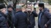 IKRAINE -- People, including Crimean Tatars, gather near a court building before the expected arrival of crew members of Ukrainian naval ships, which were recently seized by Russia's FSB security service, in Simferopol, Crimea, November 27, 2018