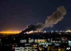 Smoke rises from an Israeli air strike that hit a southern suburb of Beirut on October 1.