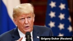 FINLAND -- U.S. President Donald Trump gestures as he speaks during a joint news conference with Russian President Vladimir Putin (not pictured) after their meeting in Helsinki, Finland July 16, 2018