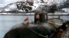 Архивное фото пришвартованной к причалу на базе Видяево (Россия) подводной лодки «Курск»