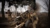 Українські військові 71-ї єгерської бригади ведуть вогонь з гаубиці М101 на передовій, неподалік від Авдіївки, Донецька область, 22 березня 2024 року