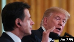 U.S. -- U.S. President Donald Trump answers a question from the media during a joint press conference with Italian Prime Minister Giuseppe Conte in the East Room of the White House in Washington, July 30, 2018