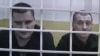Filipp Romanov (left) and Sergei Bulanov in the courtroom during their trial last year