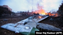 Обломки сбитого российского самолёта, 3 февраля 2018 года, провинция Идлиб, Сирия 