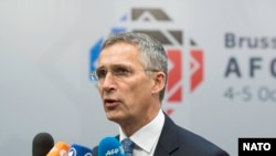 NATO Secretary-General Jens Stoltenberg speaking to journalists at a summit focusing on Afghanistan in Brussels on October 5.