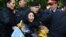 Kazakh police officers detain opposition protesters in Almaty on May 1.