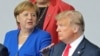 Almaniya kansleri Angela Merkel (solda) və Donald Trump Belçikada keçirilən NATO sammitində
