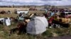 The two heads of the Statue Of Humanity lie in a municipal dump on the outskirts of Kars.