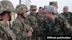 Nagorno-Karabakh - Armenian President Serzh Sarkisian shakes hands with soldiers on frontline duty, 22Oct2012.