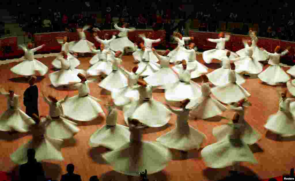 Whirling dervishes perform a traditional &quot;Sema&quot; ritual during a ceremony, one of many marking the 743rd anniversary of the death of Mevlana Jalaluddin Rumi, at Mevlana Cultural Center in Konya, Turkey, on December 8. (Reuters/Murad Sezer)