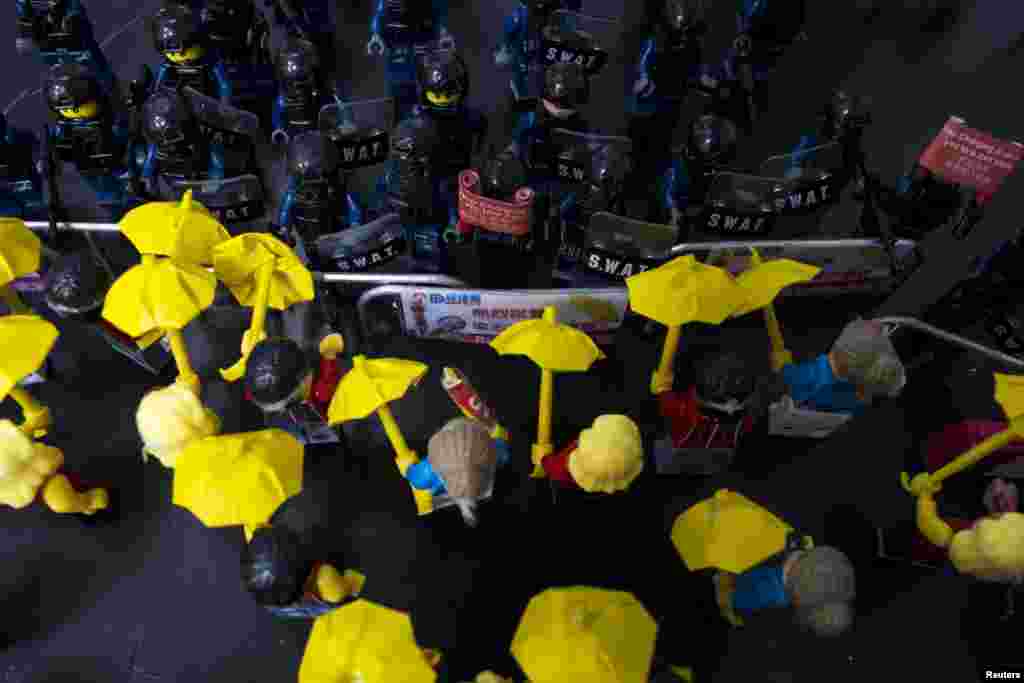 Toy Lego characters depicting a scene of protesters confronting riot police are seen on a table outside the government headquarters in Hong Kong. (Reuters/Tyrone Siu)