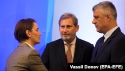 Serbian Prime Minister Ana Brnabic (left) speaks with Kosovar President Hashim Thaci (right) and EU Enlargement Commissioner Johannes Hahn, during a meeting in Sofia last month.