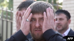 Ramzan Kadyrov prays as he visits a recently rebuilt district in Grozny on May 1.