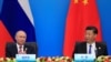 CHINA -- China's President Xi Jinping and Russia's President Vladimir Putin attend a signing ceremony during Shanghai Cooperation Organization (SCO) summit in Qingdao, Shandong Province, China June 10, 2018