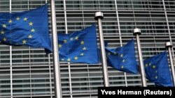 BELGIUM -- European Union flags fly outside the European Commission headquarters in Brussels, Belgium, March 6, 2019. 