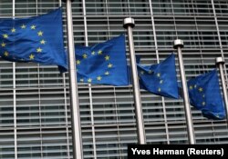 BELGIUM -- European Union flags fly outside the European Commission headquarters in Brussels, Belgium, March 6, 2019. 