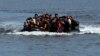 Refugees from Afghanistan arrive in an overloaded rubber dinghy at the coast near Mytilini, Lesbos island, Greece, after crossing the Mediterranean Sea from Turkey. (file photo)