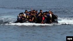 Refugees from Afghanistan arrive in an overloaded rubber dinghy at the coast near Mytilini, Lesbos island, Greece, after crossing the Mediterranean Sea from Turkey. (file photo)