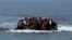 Refugees from Afghanistan arrive in an overloaded rubber dinghy at the coast near Lesbos island in Greece (file photo).