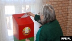 A voter casts a ballot in Fanipal, near Minsk.