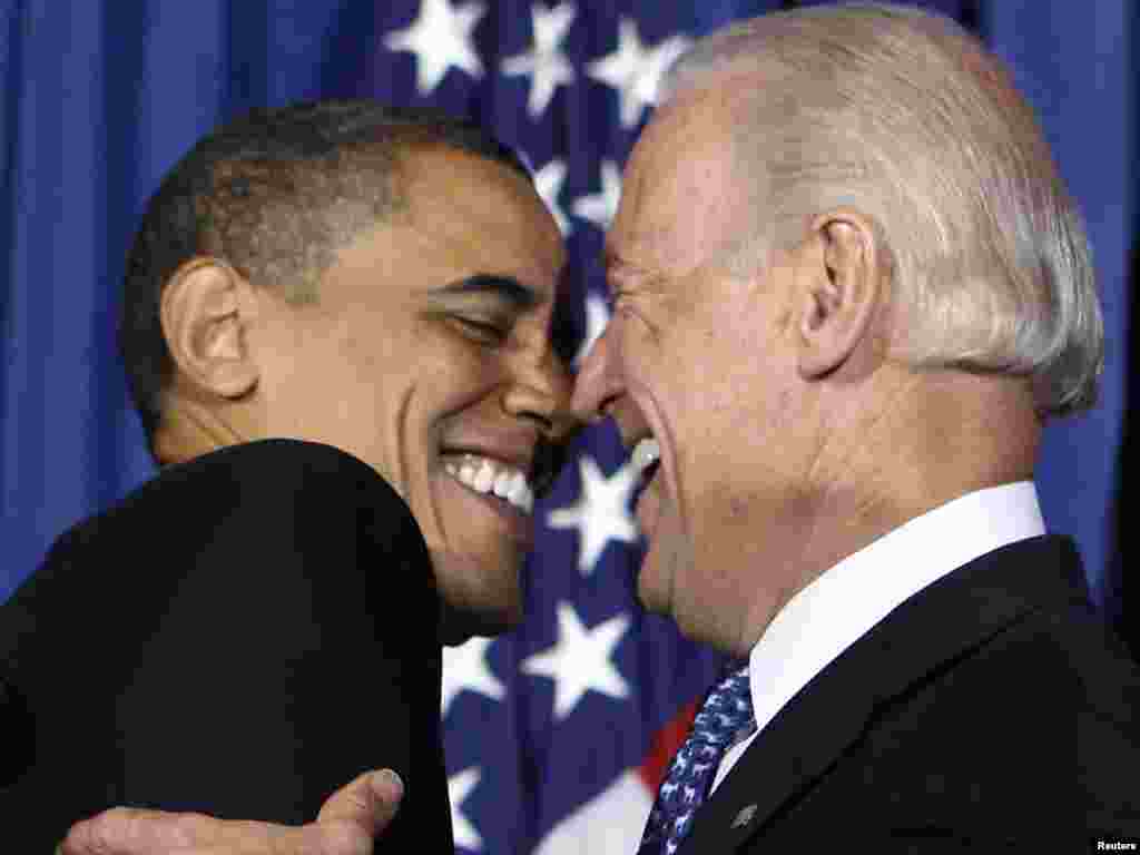 U.S. President Barack Obama and Vice President Joe Biden celebrate the signing of a health-care reform bill on March 23. - Photo by Larry Downing of Reuters