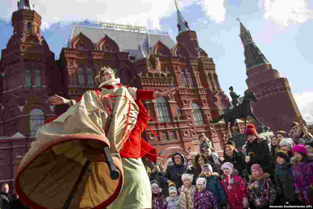 An artist performs during Maslenitsa (Shrovetide) holiday celebrations in front of the Historical Museum in Manezh Square near the Kremlin Wall in Moscow on March 9.&nbsp;&nbsp;(AP/Aleksandr Zemlyanichenko)&nbsp;
