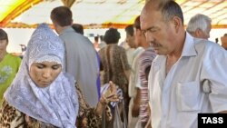 Женщина в мусульманском платке на рынке в Ташкенте. Иллюстративное фото.