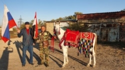 Ullubii (left) with Azzan and Star of Putin in Daghestan