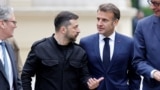 Ukrainian President Volodymyr Zelenskyy speaks with French President Emmanuel Macron (right), British Prime Minister Keir Starmer (left), and German Chancellor Friedrich Merz during a meeting in Kyiv on May 10.