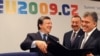 European Commission President Jose Manuel Barroso (left) shows Turkish President Abdullah Gul (right) and Azebaijani President Ilham Aliyev documents after the signing of the Nabucco pipeline agreement plan in Prague.