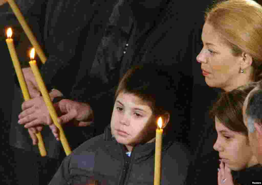 Djindjic&#39;s son Luka, wife, Ruzica, and daughter Jovana at the funeral service