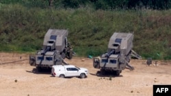 Israeli artillery vehicles are deployed in the Upper Galilee near the Israel-Lebanon border on April 16.