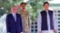 Afghan President Ashraf Ghani (left) and Pakistani Prime Minister Imran Khan (right) review an honor guard during a welcoming ceremony in Islamabad on June 27. 