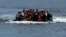 Refugees from Afghanistan arrive in an overloaded rubber dinghy at the coast near Mytilini, Lesbos island, Greece, after crossing the Mediterranean Sea from Turkey. (file photo)