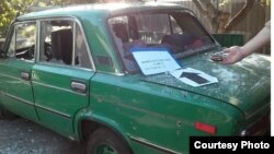 Автомобиль в Новолуганском, поврежденный осколками противотанковых гранат, 12 августа 2017 года, фото Общего центра контроля и координации 