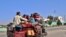 AFGHANISTAN -- Internally displaced people with their belongings flee from Nadali district to Lashkar Gah during the ongoing clashes between Taliban fighters and Afghan security forces, in Helmand province, October 14, 2020
